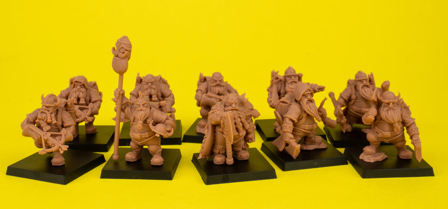 a group of toy figurines on a shelf a group of toy figurines on a shelf
