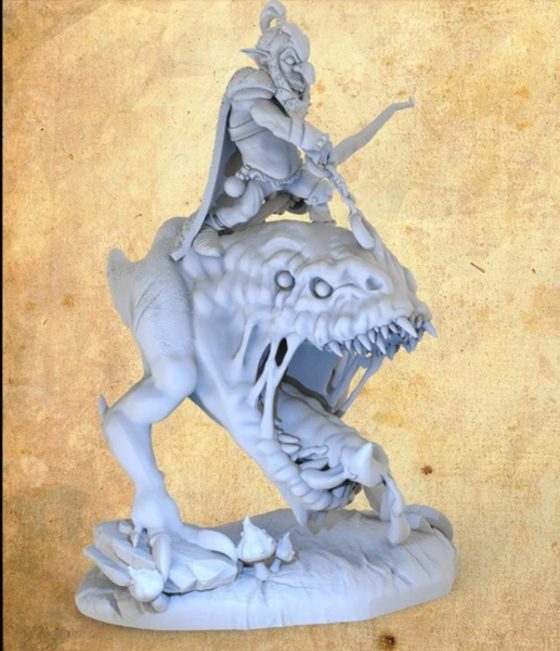 a statue of a woman riding a dragon