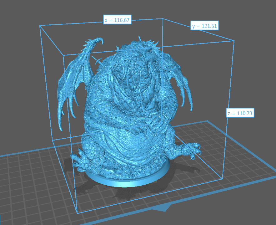 a statue of a demon sitting on top of a table a statue of a demon sitting on top of a table
