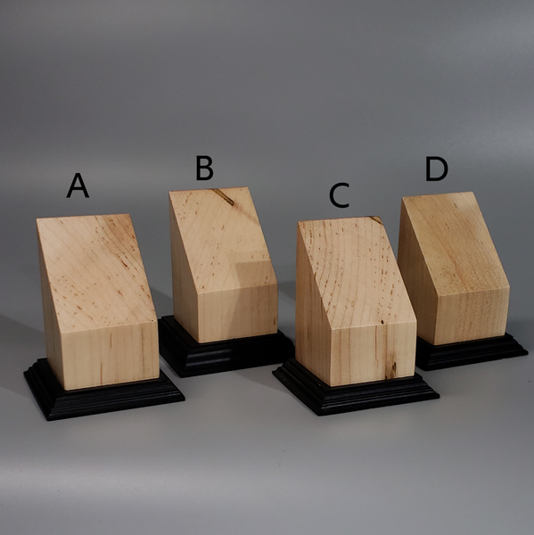 a group of three wooden blocks sitting on top of each other
