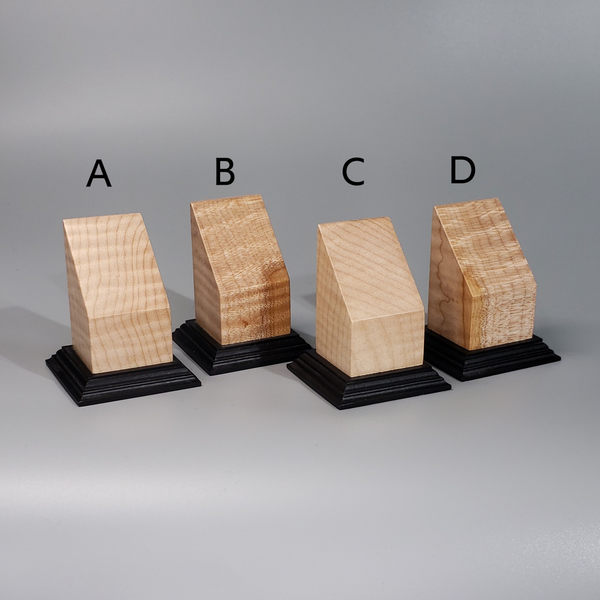 three pieces of wood sitting on top of each other