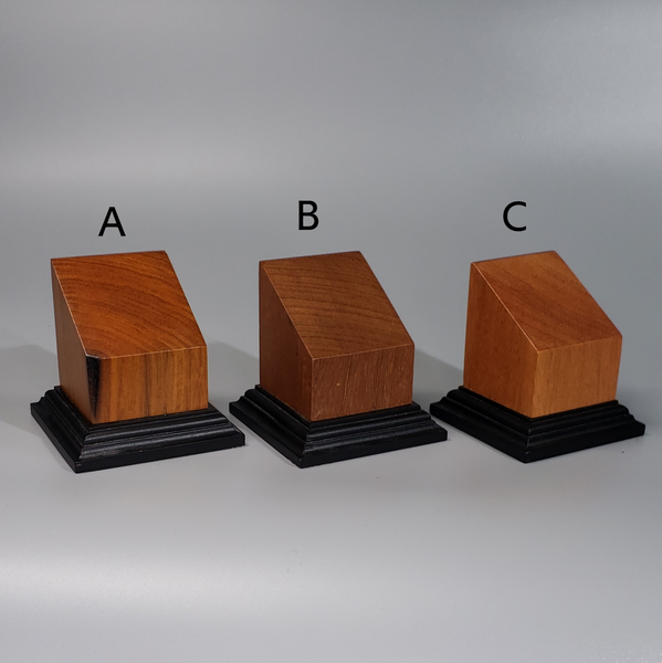 three wooden blocks sitting on top of each other