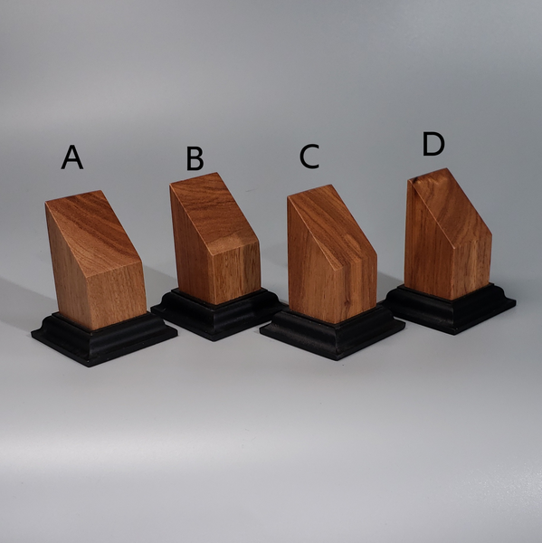 a group of three wooden blocks sitting next to each other